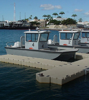 boats docked in a floating dock system