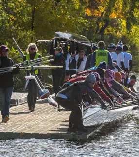 Team of rowers on a rowing dock