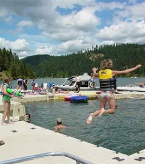 Child jumping off of EZ Trail floating dock