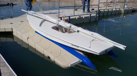 A docked white sail boat