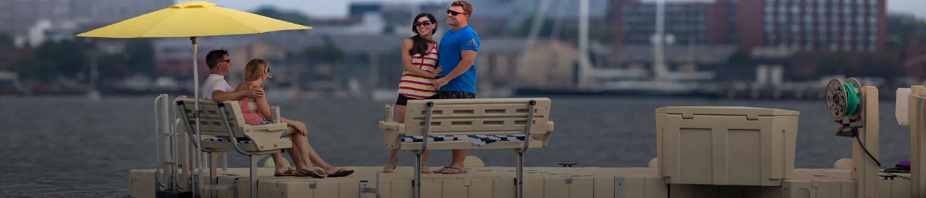 Couples embracing on floating dock