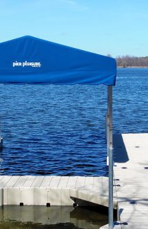 Floating dock with outdoor furniture and awning