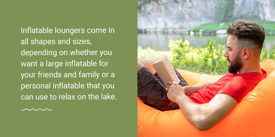 A man reads on a bright orange inflatable lounger