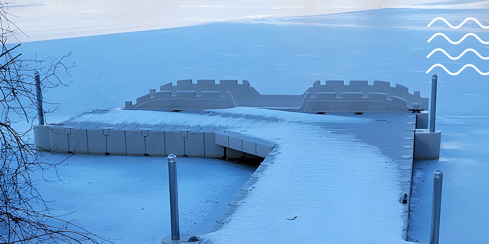 White dock for jet skis covered in snow and surrounded by ice during winter