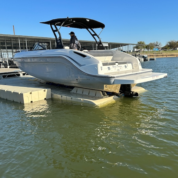 Motorboat on an EZ Dock Optimus floating dry dock