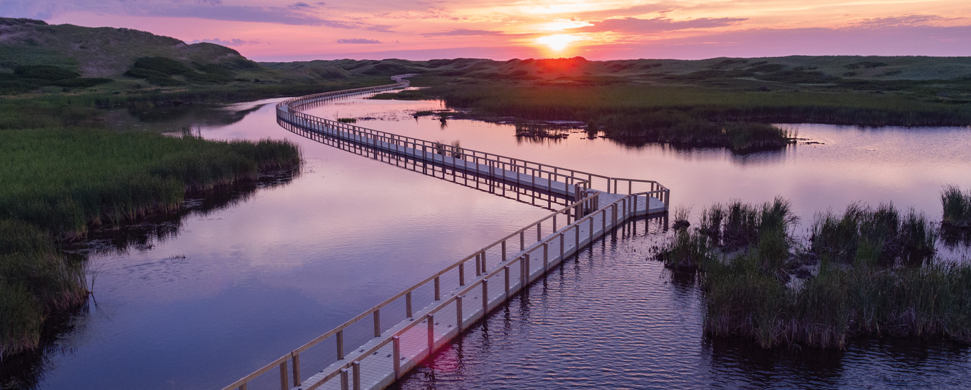 EZ Trail floating walkway, aerial view of long walkway, sunset